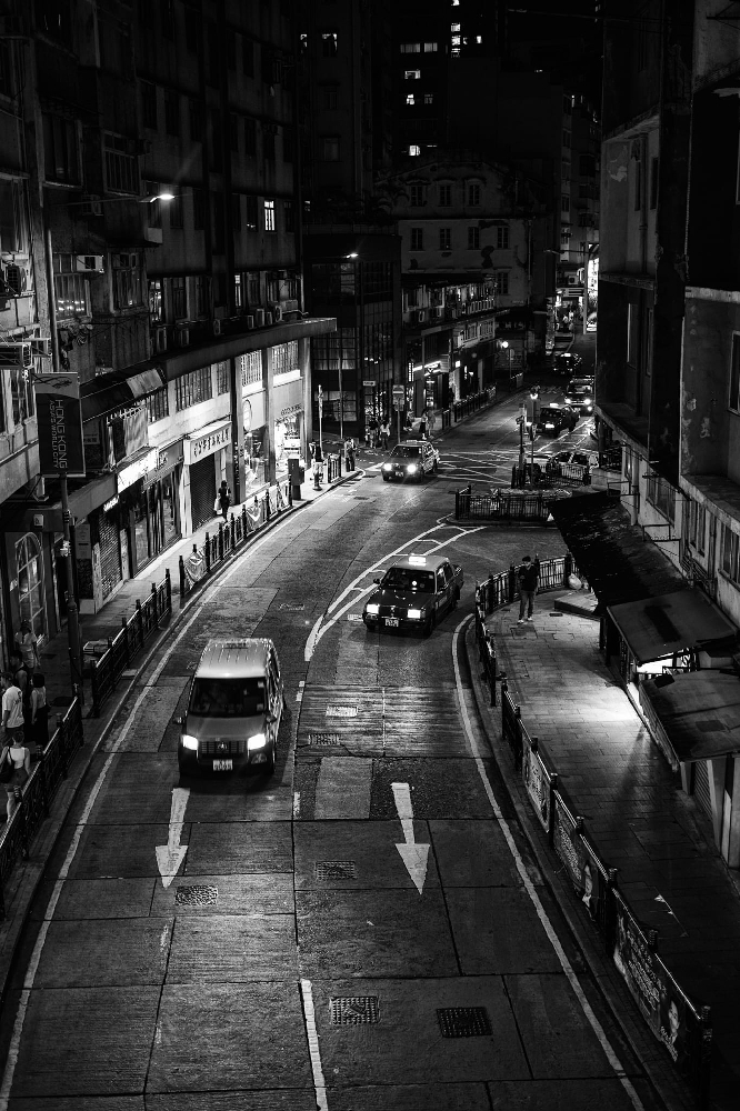 Black and white night photograph of a Hong Kong crossing with taxis, Leica Summicron 35mm 8-element