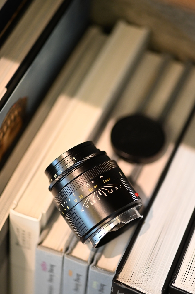 Original Leica ELCAN 66mm f/2 barrel showing the military specification distance scale, orange feet markings, focal length engraving and M bayonet mount