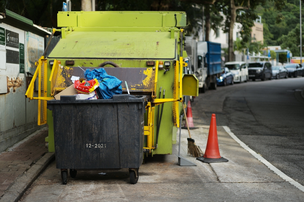 ELCAN 66mm f/2 photo sample — a Hong Kong refuse collection vehicle and bin parked on a suburban street